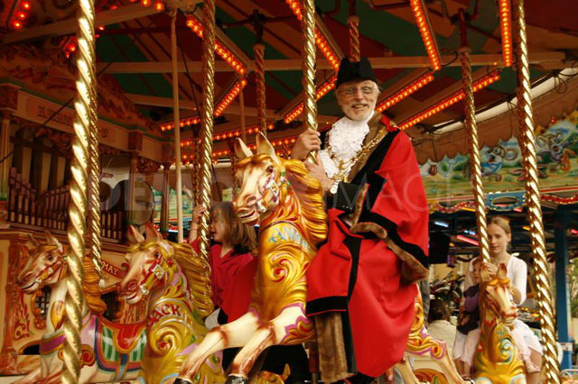 Image of the mayor riding the gallopers at the opening of Oxford St Giles Fair
